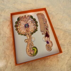 Peacock mirror and comb set.